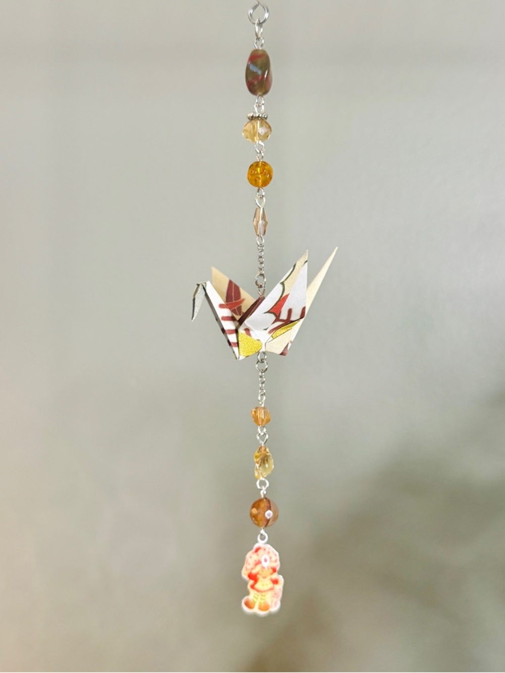 Origami Ornament #2471 - Small Crane with Repurposed Strawberry Shortcake Charm